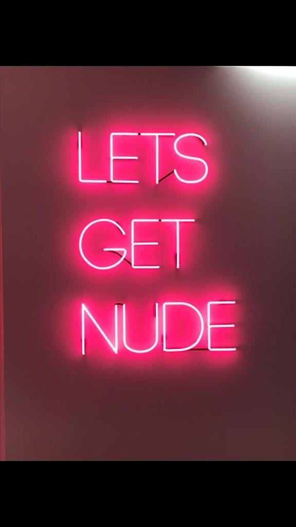 Lets get nude sign with pink lettering designed by us