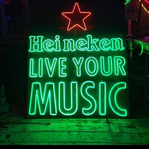 Green Neon Heineken logo with text live your music