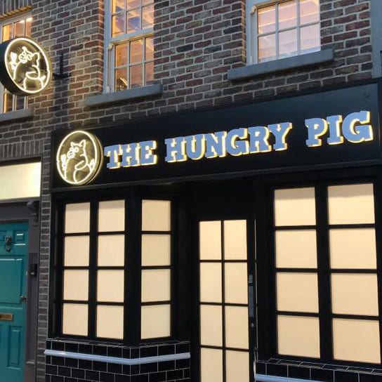 hungry pig shopfront blneonsign